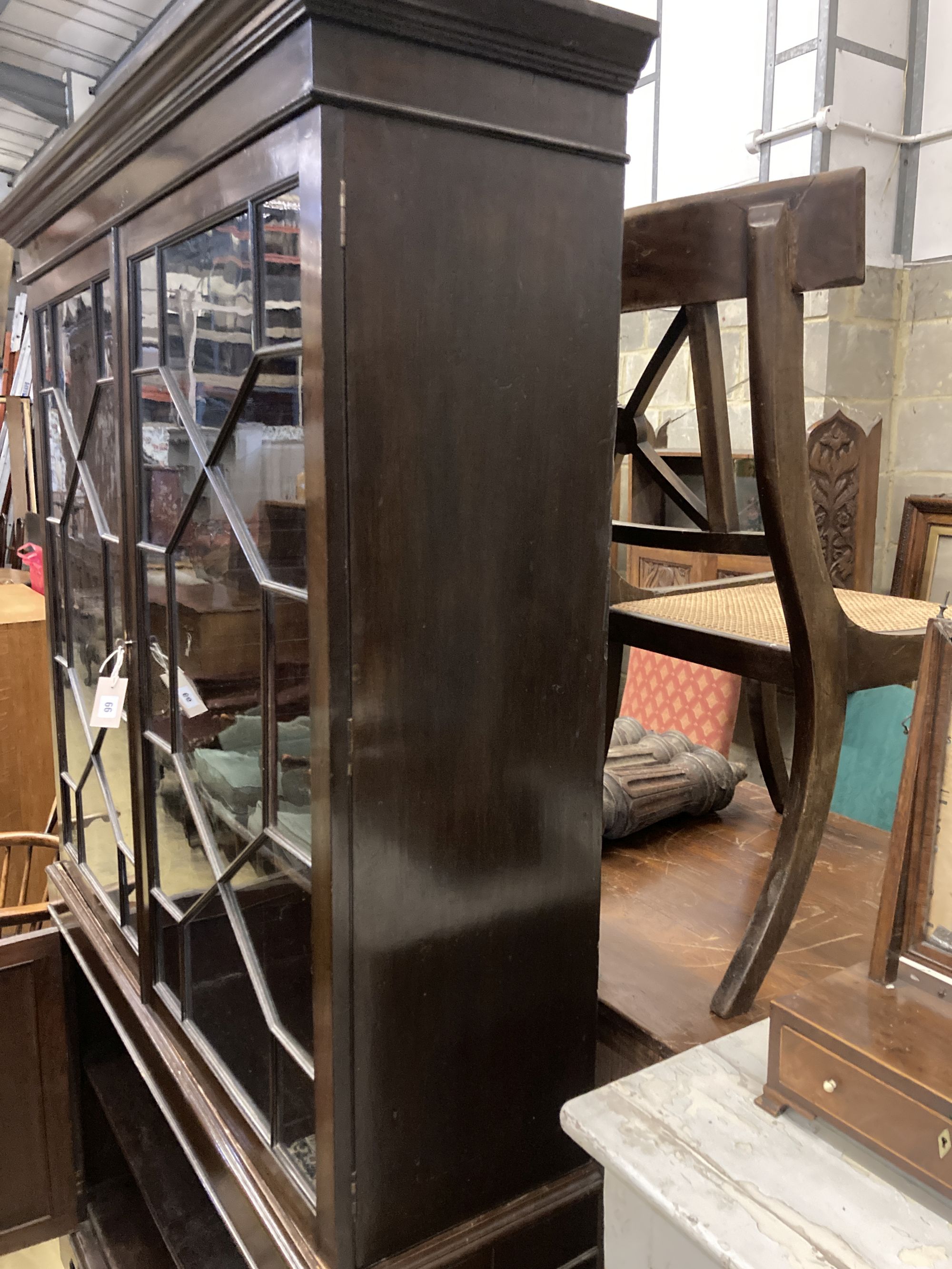 A reproduction George III style mahogany glazed bookcase, length 126cm, depth 34cm, height 206cm